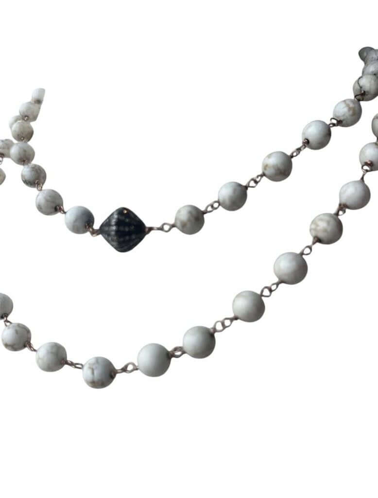 The Jewels by Piper Beaded Necklace is a stunning accessory featuring elegant beads paired with a diamond-encrusted bead for a touch of luxury. Its refined design combines classic beading with sparkling accents, making it a versatile and sophisticated piece for any occasion.