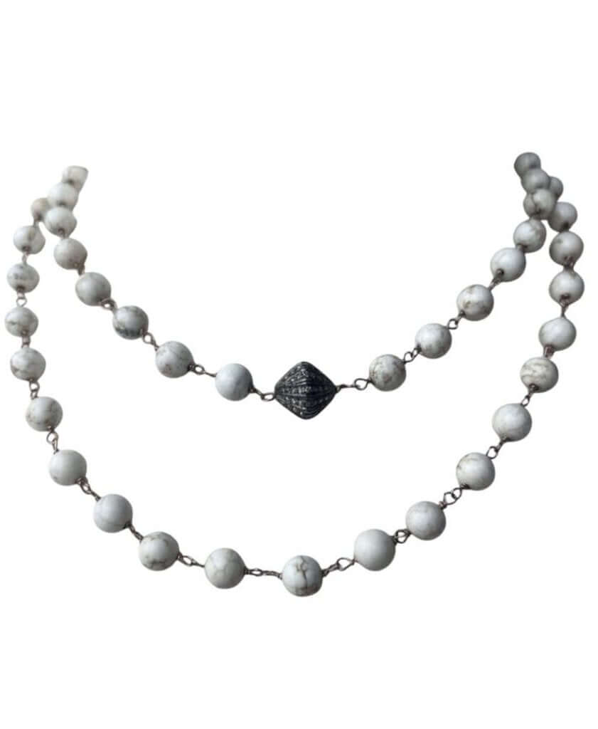 The Jewels by Piper Beaded Necklace is a stunning accessory featuring elegant beads paired with a diamond-encrusted bead for a touch of luxury. Its refined design combines classic beading with sparkling accents, making it a versatile and sophisticated piece for any occasion.