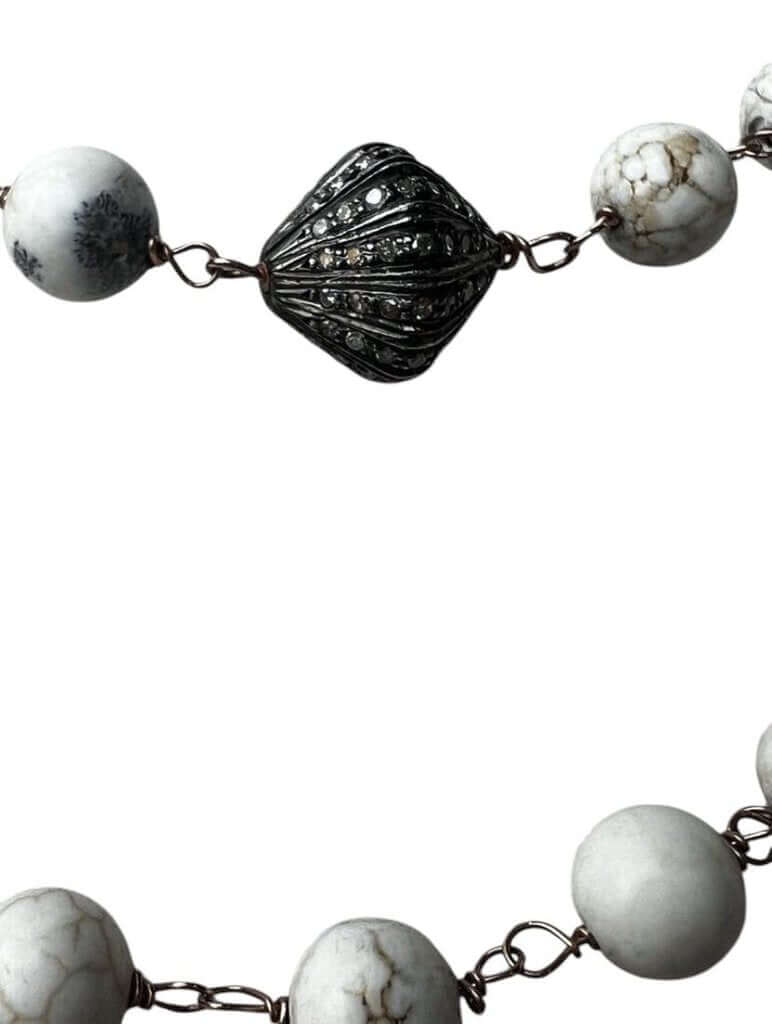 The Jewels by Piper Beaded Necklace is a stunning accessory featuring elegant beads paired with a diamond-encrusted bead for a touch of luxury. Its refined design combines classic beading with sparkling accents, making it a versatile and sophisticated piece for any occasion.
