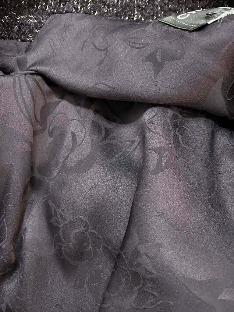 The CHANEL Wool/Cashmere Blend Overcoat with a Detached Scarf is a refined and timeless outerwear piece, combining the warmth of wool and cashmere for ultimate comfort. The detachable scarf adds versatility, allowing for various styling options while maintaining the coat’s sophisticated, elegant silhouette.