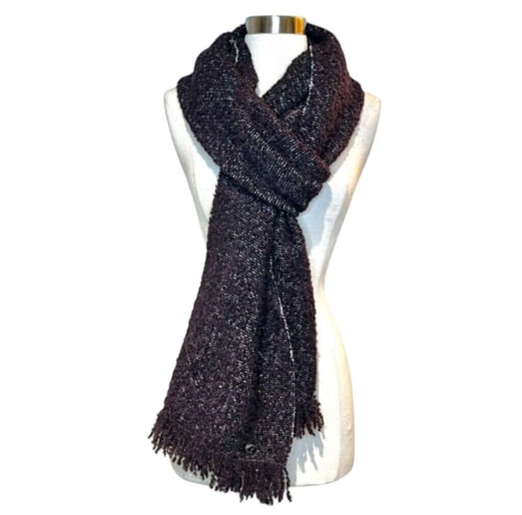 The CHANEL Wool/Cashmere Blend Overcoat with a Detached Scarf is a refined and timeless outerwear piece, combining the warmth of wool and cashmere for ultimate comfort. The detachable scarf adds versatility, allowing for various styling options while maintaining the coat’s sophisticated, elegant silhouette.