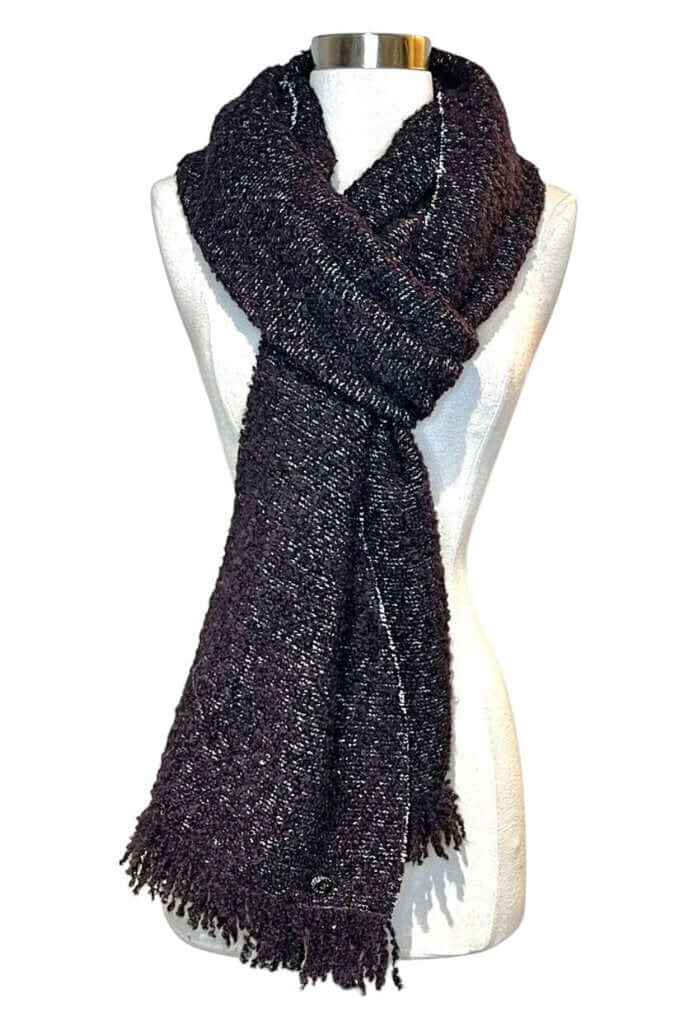 The CHANEL Wool/Cashmere Blend Overcoat with a Detached Scarf is a refined and timeless outerwear piece, combining the warmth of wool and cashmere for ultimate comfort. The detachable scarf adds versatility, allowing for various styling options while maintaining the coat’s sophisticated, elegant silhouette.