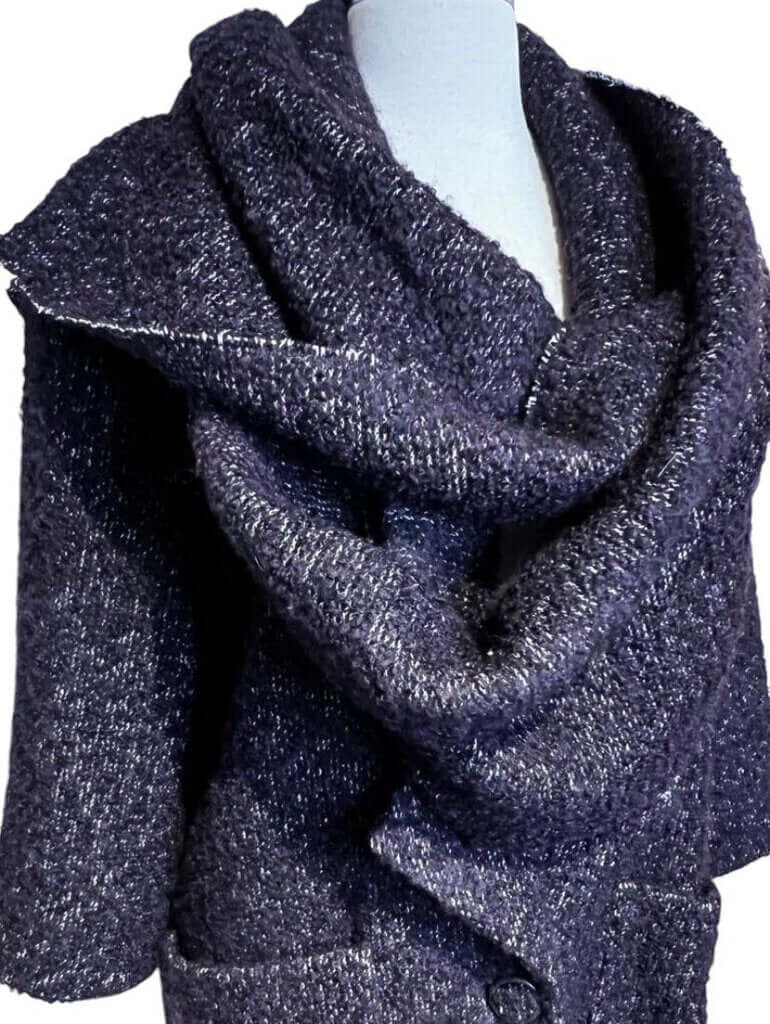 The CHANEL Wool/Cashmere Blend Overcoat with a Detached Scarf is a refined and timeless outerwear piece, combining the warmth of wool and cashmere for ultimate comfort. The detachable scarf adds versatility, allowing for various styling options while maintaining the coat’s sophisticated, elegant silhouette.