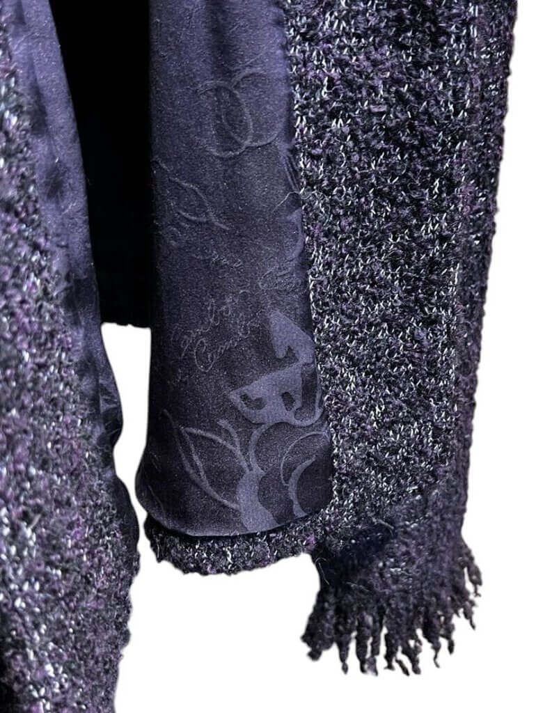 The CHANEL Wool/Cashmere Blend Overcoat with a Detached Scarf is a refined and timeless outerwear piece, combining the warmth of wool and cashmere for ultimate comfort. The detachable scarf adds versatility, allowing for various styling options while maintaining the coat’s sophisticated, elegant silhouette.