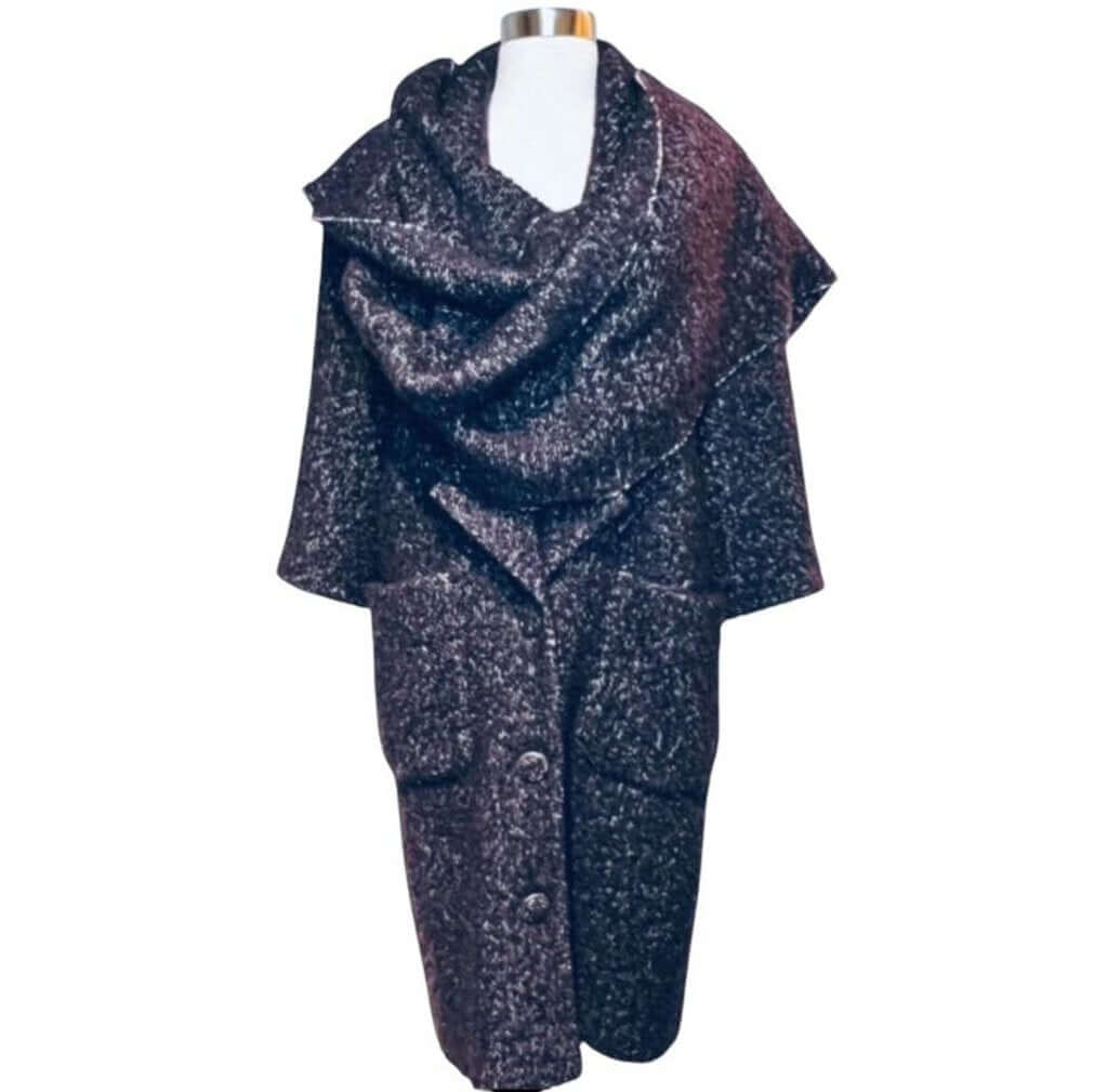 The CHANEL Wool/Cashmere Blend Overcoat with a Detached Scarf is a refined and timeless outerwear piece, combining the warmth of wool and cashmere for ultimate comfort. The detachable scarf adds versatility, allowing for various styling options while maintaining the coat’s sophisticated, elegant silhouette.