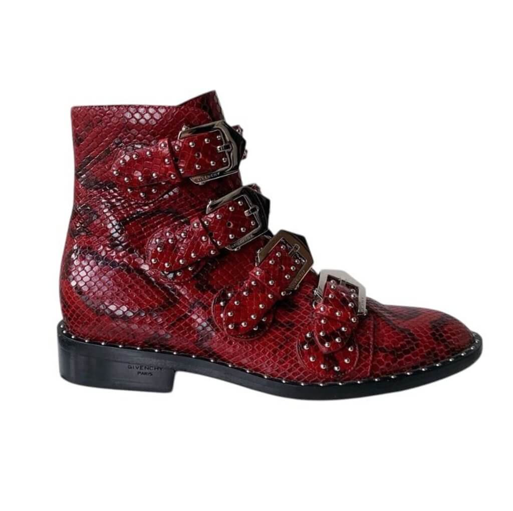 The Givenchy Ankle-High Snake-Embossed Studded Calfskin Boots fuse edgy sophistication with luxurious craftsmanship, featuring a bold snake-embossed leather design and striking studded accents. With their sleek ankle-high silhouette and durable calfskin construction, these boots make a powerful statement, perfect for adding a rebellious yet refined touch to any outfit.