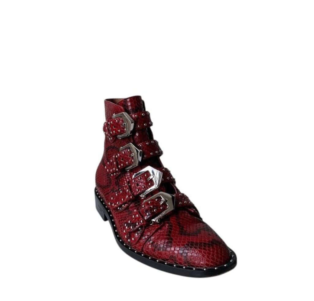 The Givenchy Ankle-High Snake-Embossed Studded Calfskin Boots fuse edgy sophistication with luxurious craftsmanship, featuring a bold snake-embossed leather design and striking studded accents. With their sleek ankle-high silhouette and durable calfskin construction, these boots make a powerful statement, perfect for adding a rebellious yet refined touch to any outfit.