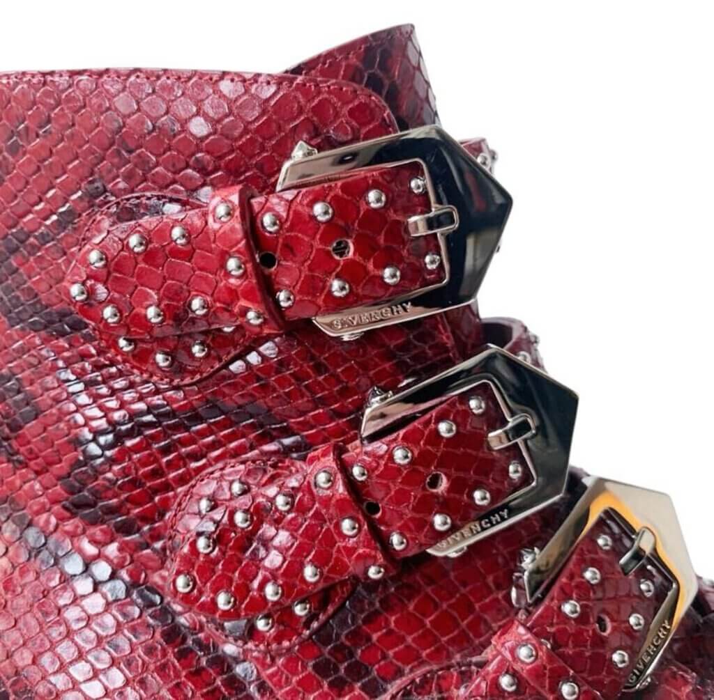 The Givenchy Ankle-High Snake-Embossed Studded Calfskin Boots fuse edgy sophistication with luxurious craftsmanship, featuring a bold snake-embossed leather design and striking studded accents. With their sleek ankle-high silhouette and durable calfskin construction, these boots make a powerful statement, perfect for adding a rebellious yet refined touch to any outfit.
