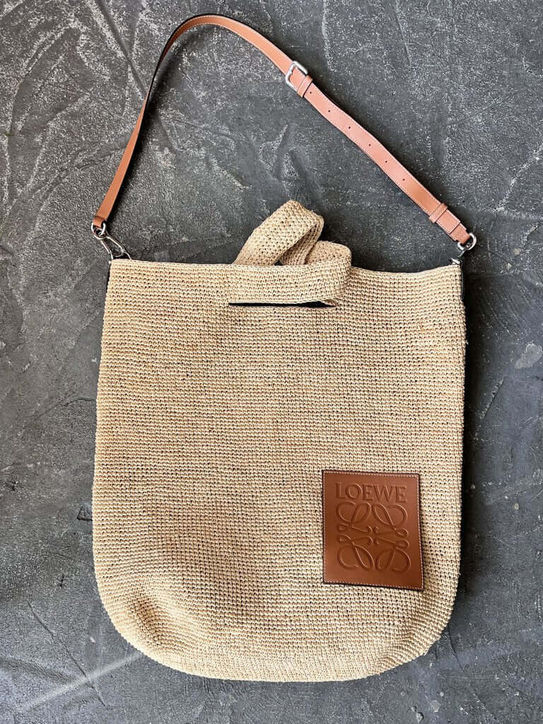Katybird is a consignment boutique in Madrona, Seattle offering authentic Loewe Raffia & Calf cardigans, blouses, dresses, cashmere, sweaters, outerwear, accessories, handbags, shoes, and much more. Loewe Raffia & Calf Leather Ibiza Slit Bag