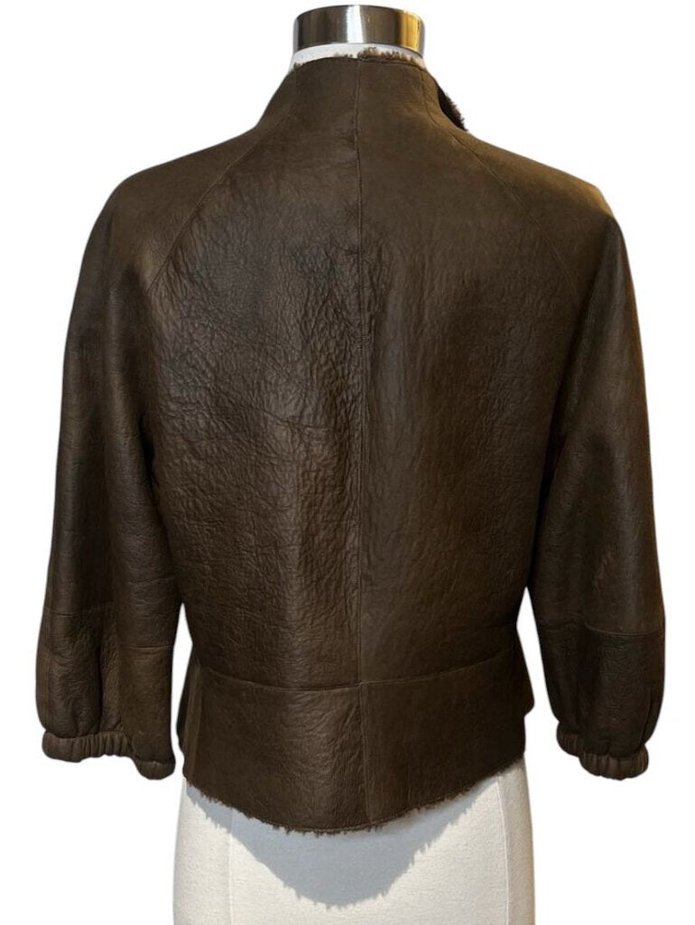 The Akris Leather Jacket combines timeless elegance with a modern, sleek design, crafted from premium leather for a sophisticated look. Its tailored fit and minimalist detailing make it a versatile wardrobe staple that exudes understated luxury.