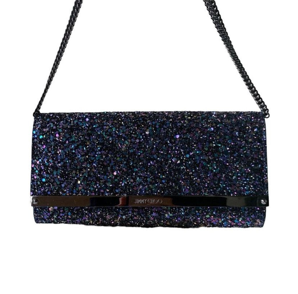 The Jimmy Choo Sequined Evening Purse is a dazzling, high-impact accessory that combines intricate sequins with luxurious craftsmanship for a striking, sophisticated look. With its sleek, compact design and shimmering finish, this purse adds a touch of glamour to evening wear, making it the perfect statement piece for formal occasions and special events.