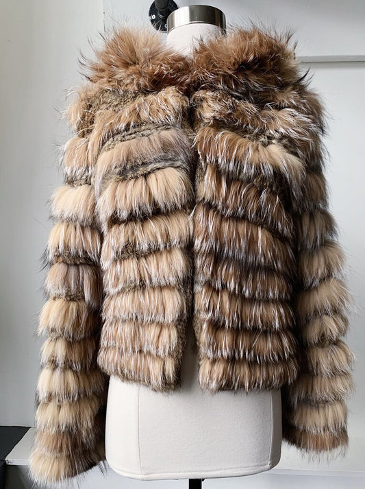 The Alice + Olivia Hooded Rabbit Fur Channeled Jacket is a luxurious outerwear piece that combines elegance with warmth, featuring a chic channeled design in soft rabbit fur. Its cozy hood and stylish silhouette make it a standout choice for both casual and sophisticated occasions.