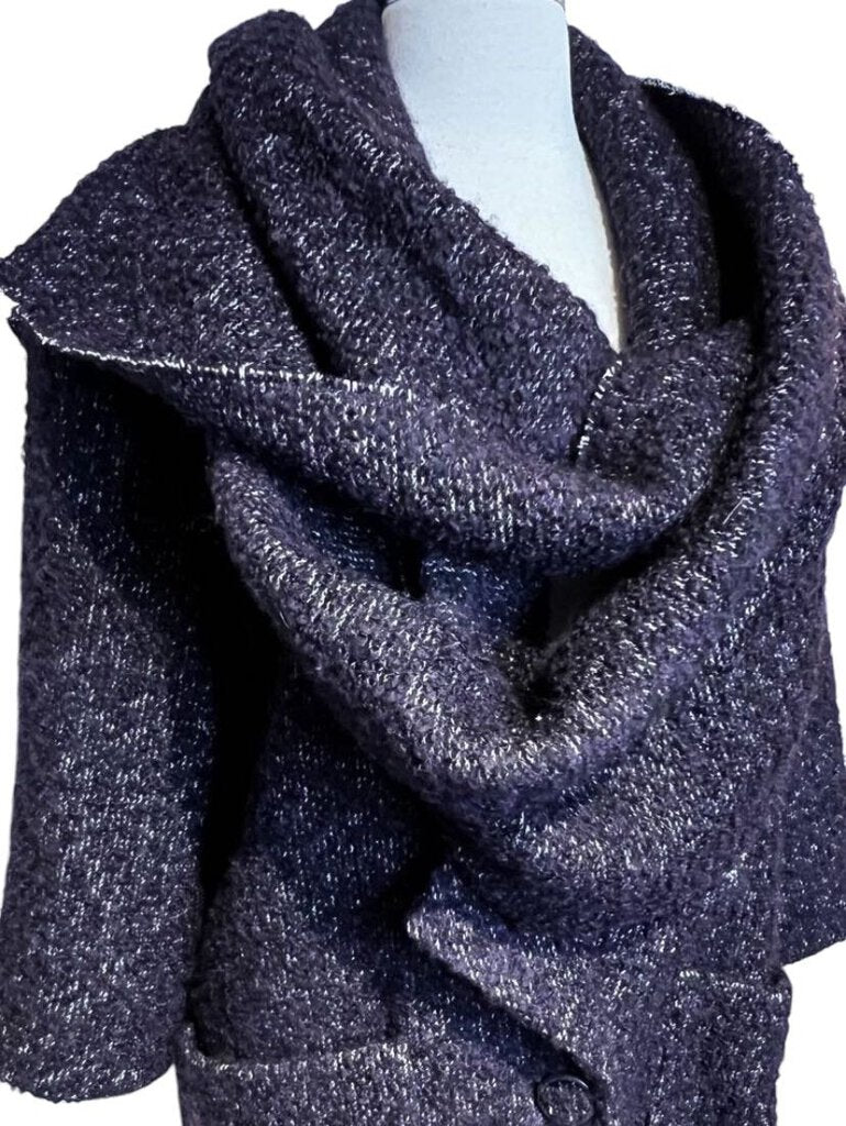 The CHANEL Wool/Cashmere Blend Overcoat with Detached Scarf combines luxurious warmth and elegance, crafted from a rich wool-cashmere blend for a soft, refined feel. The detachable scarf adds versatility and style, making it a sophisticated outerwear piece that effortlessly elevates any winter wardrobe.