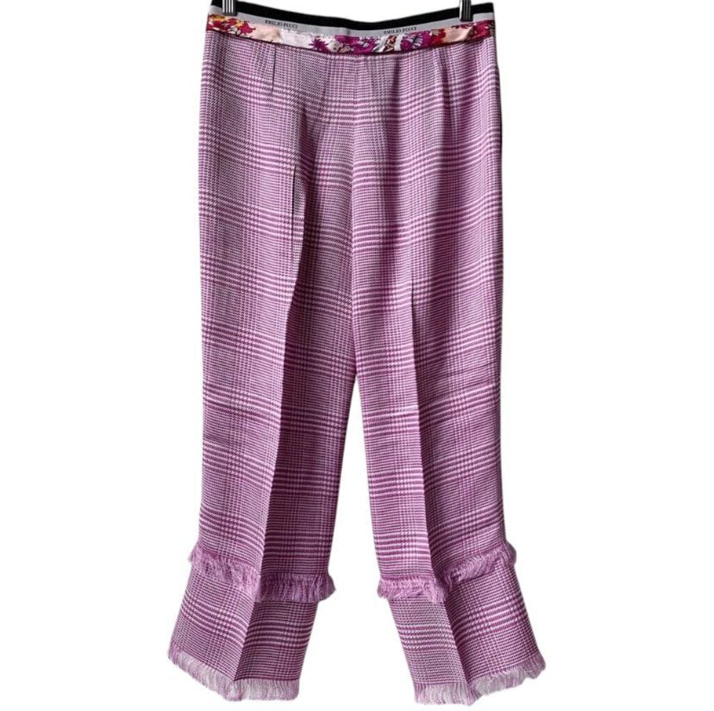 Emilio Pucci Plaid Wide Leg Trousers blend bold, graphic patterns with a relaxed, contemporary silhouette. Crafted from luxurious fabric, these trousers offer a chic balance of comfort and high-fashion, making them a statement piece for both casual and refined looks.