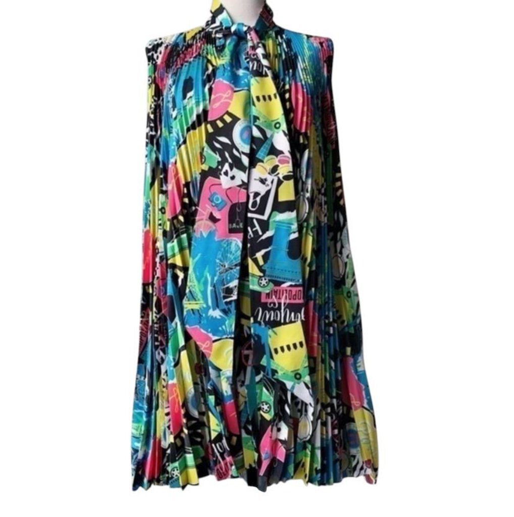 The Balenciaga Sleeveless Knife Pleated Graphic Pop Print Dress is a bold, statement-making piece that combines intricate knife pleats with vibrant, eye-catching graphic prints. Its modern silhouette and dynamic design create a perfect balance of art and fashion, making it a standout choice for those seeking to make a fashionable impact.