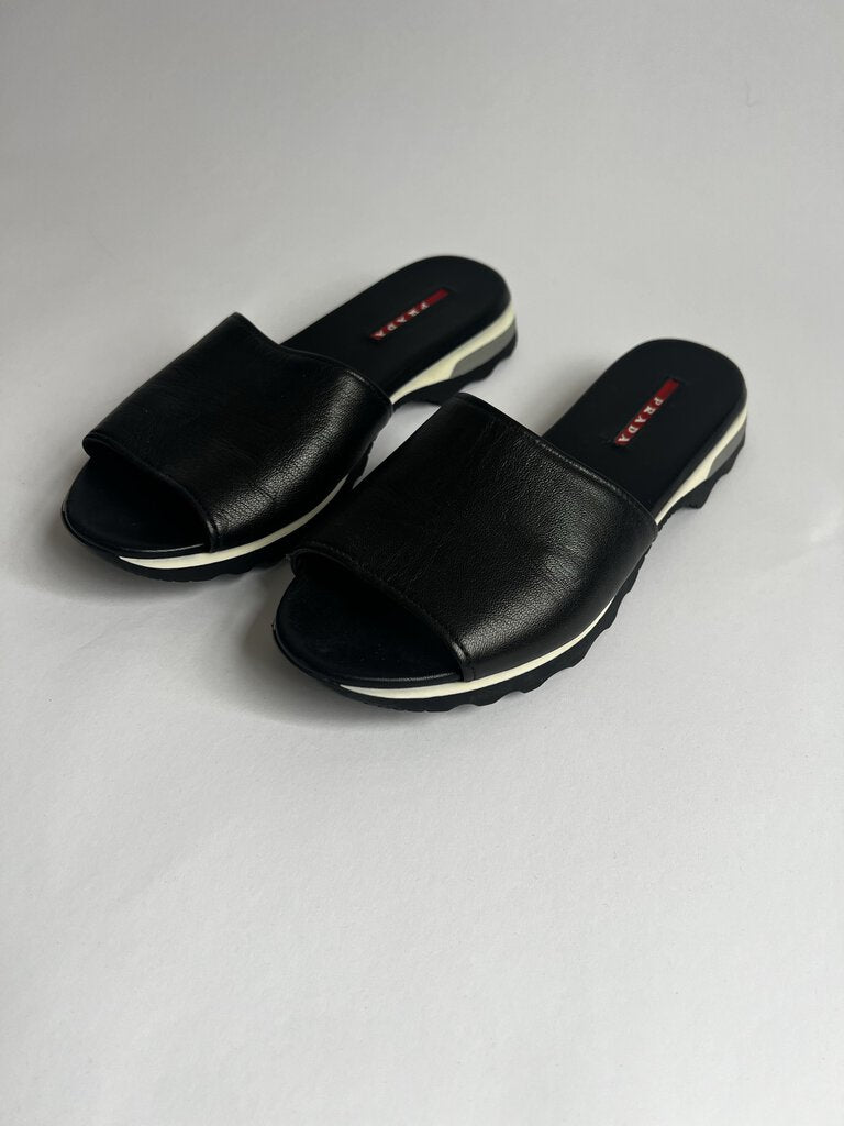 PRADA Black Sandals in size 39.5 offer a sleek and stylish option for any occasion, combining the renowned PRADA brand with a comfortable and versatile design.