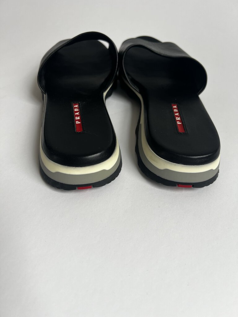 PRADA Black Sandals in size 39.5 offer a sleek and stylish option for any occasion, combining the renowned PRADA brand with a comfortable and versatile design.