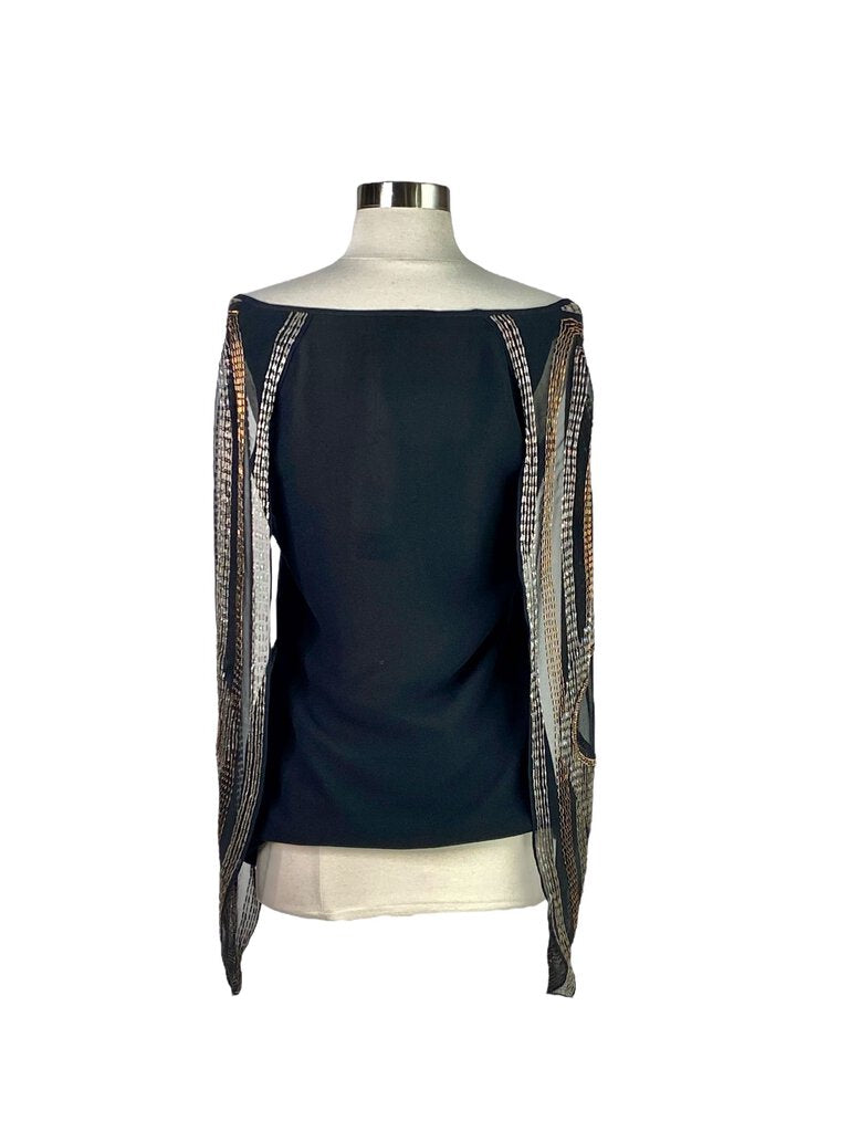 The AKA New York Silk Beaded Winged Blouse is an elegant, flowy top crafted from luxurious silk, adorned with intricate beadwork that creates a stunning winged design across the shoulders. Its combination of soft draping and glamorous embellishments makes it a statement piece for both day-to-night wear.