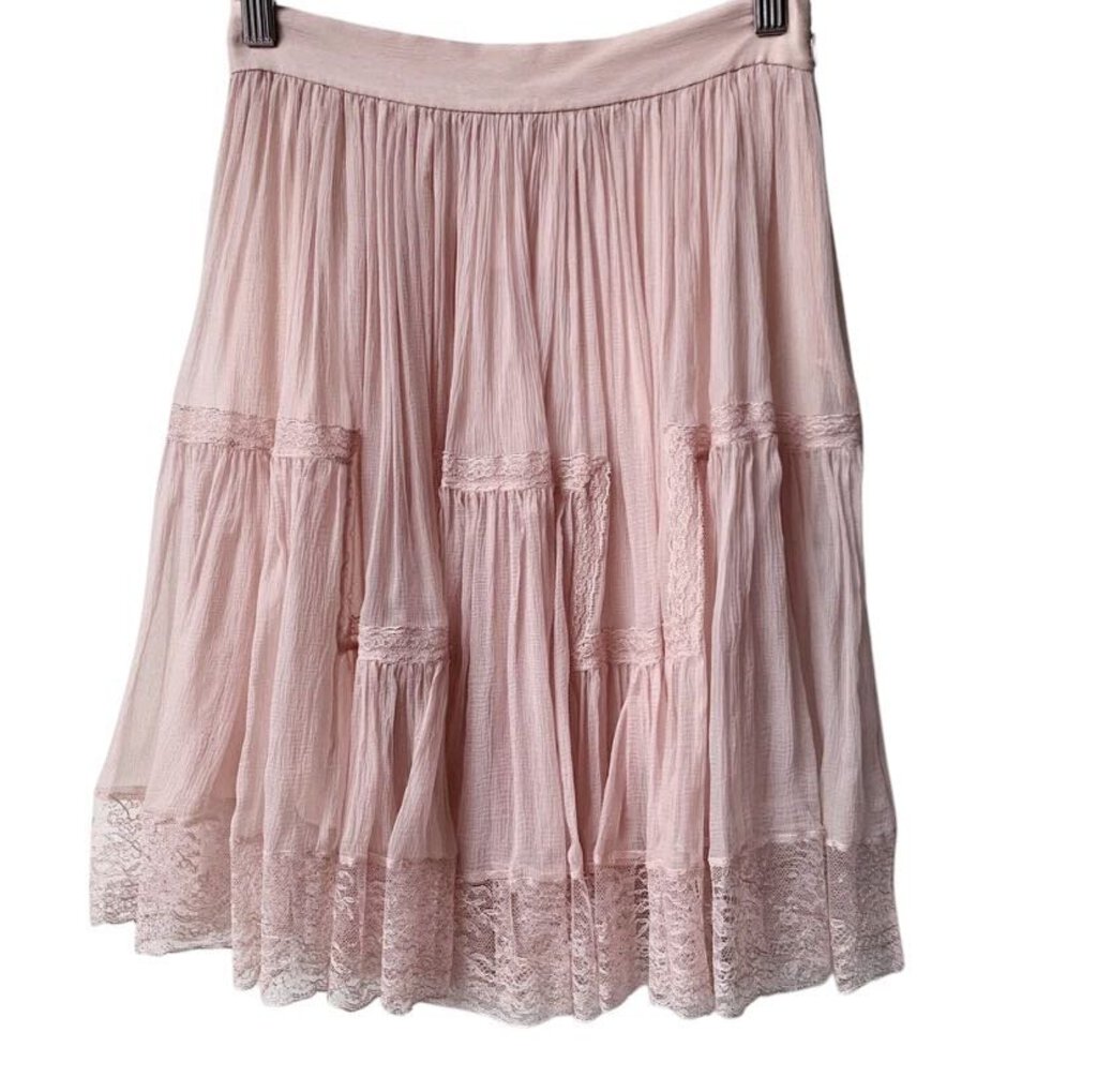 The Christian Dior Silk Chiffon Skirt is a luxurious, ethereal piece crafted from lightweight, flowing silk chiffon that drapes beautifully on the body. With its delicate, soft texture and timeless silhouette, this skirt exudes refined elegance and feminine grace, perfect for both formal occasions and sophisticated everyday wear.