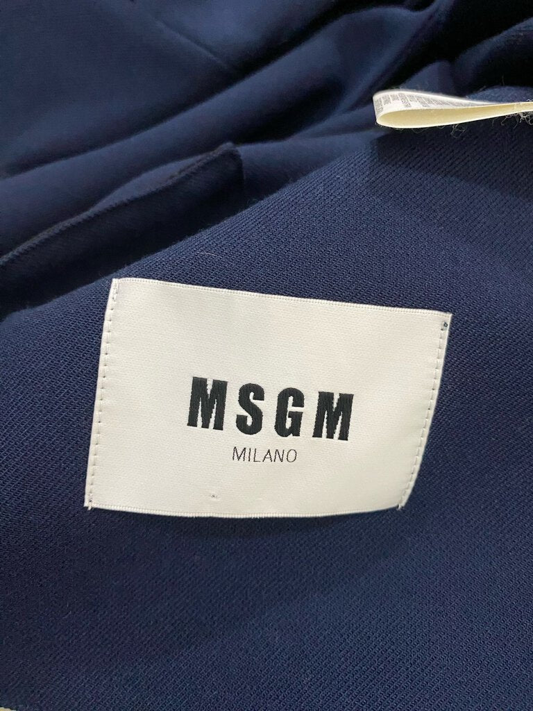 The MSGM Milano Wool Blend Blazer combines sharp tailoring with a modern twist, crafted from a luxurious wool blend for a polished yet comfortable fit. Featuring clean lines, structured shoulders, and a contemporary silhouette, this blazer adds sophistication with a touch of Italian flair, perfect for both professional and casual looks.