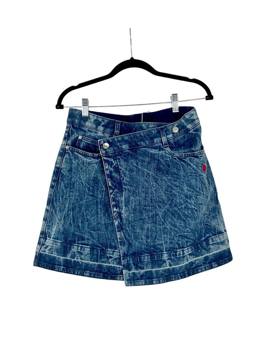 The Stella McCartney Denim Asymmetrical Mini Skirt is a bold and contemporary piece, featuring a unique asymmetrical design that adds an edgy twist to classic denim. Crafted from high-quality materials, this mini skirt combines style and sustainability, making it a standout choice for fashion-forward looks.