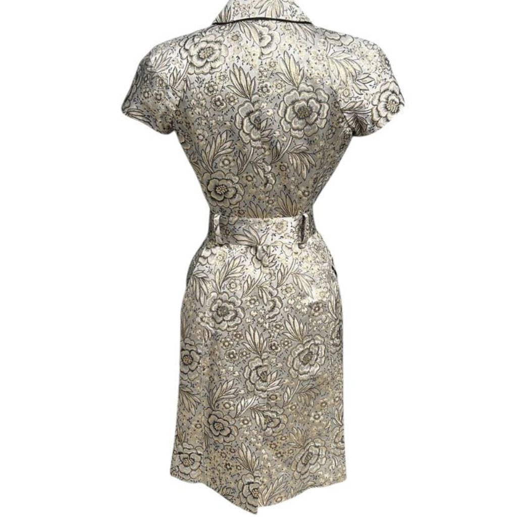 The Burberry Prorsum Jacquard Floral Belted Dress combines elegant floral jacquard fabric with a structured silhouette, creating a refined and feminine look. The cinched waist and flattering A-line shape, along with the luxurious craftsmanship, make it a standout piece for both formal occasions and stylish daywear.