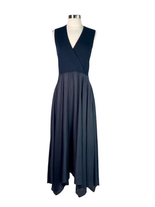 The Theory Mixed Media Surplice Maxi Dress is an effortlessly chic piece that combines soft fabrics with a sleek silhouette, featuring a flattering surplice neckline. Its maxi length and versatile design make it perfect for both casual outings and more formal occasions, offering comfort without compromising on style.