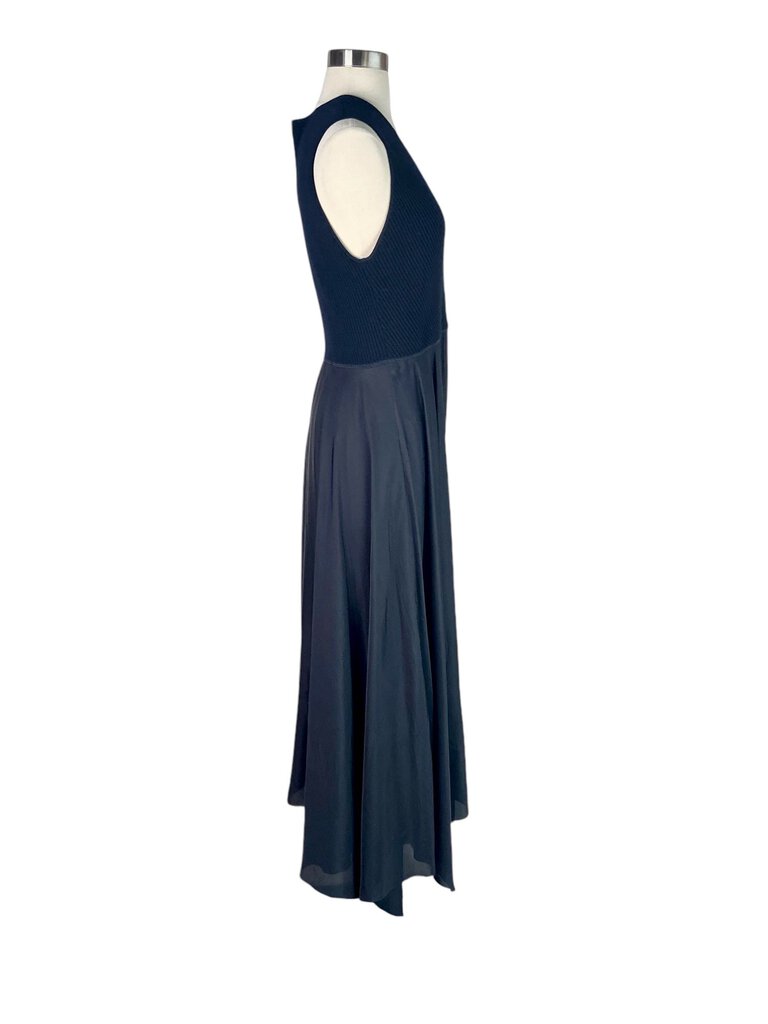 The Theory Mixed Media Surplice Maxi Dress is an effortlessly chic piece that combines soft fabrics with a sleek silhouette, featuring a flattering surplice neckline. Its maxi length and versatile design make it perfect for both casual outings and more formal occasions, offering comfort without compromising on style.