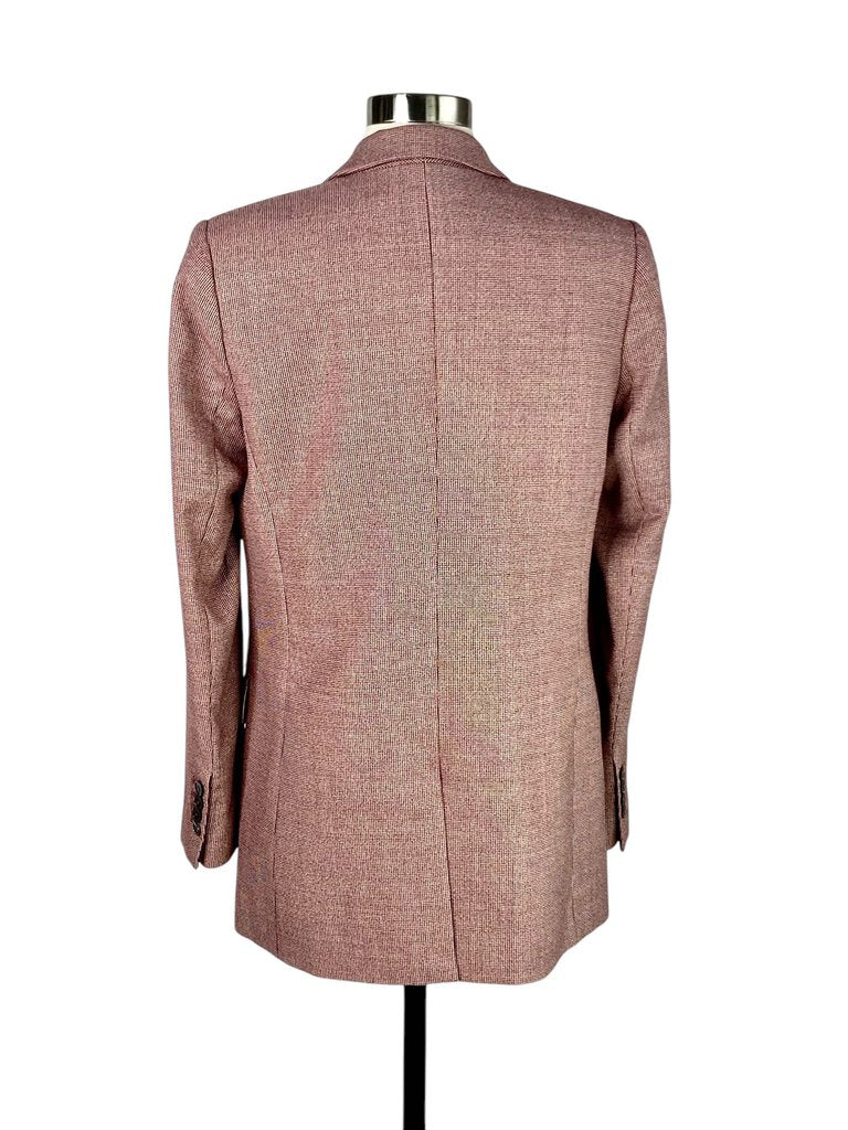 The Equipment Single Breasted Wool Blazer is a sleek, tailored piece crafted from luxurious wool, offering a clean, minimalist design that exudes timeless sophistication. Its single-breasted closure and structured silhouette make it a versatile wardrobe essential, perfect for both professional and casual settings.