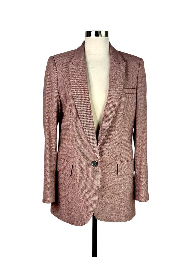 The Equipment Single Breasted Wool Blazer is a sleek, tailored piece crafted from luxurious wool, offering a clean, minimalist design that exudes timeless sophistication. Its single-breasted closure and structured silhouette make it a versatile wardrobe essential, perfect for both professional and casual settings.