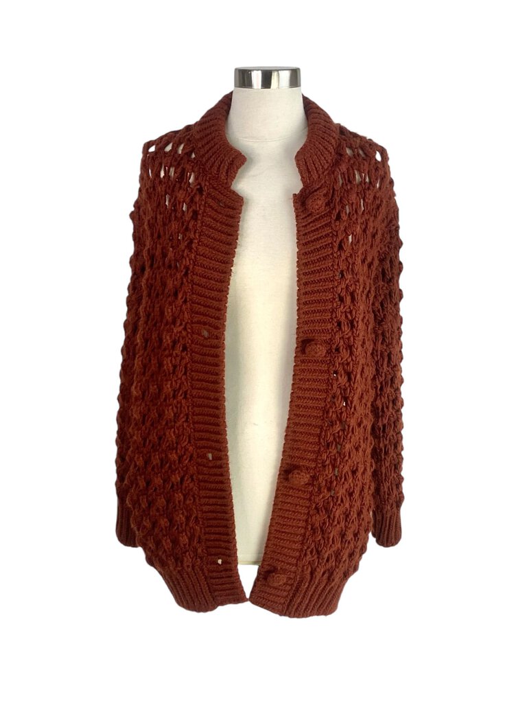 The Forte Forte Open Weave Cardigan is a beautifully crafted piece that features a delicate open weave design, adding texture and lightness. Its relaxed fit and airy fabric make it perfect for layering over casual outfits or using as a stylish cover-up for more polished looks.