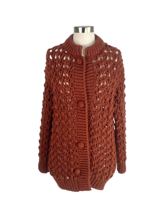 The Forte Forte Open Weave Cardigan is a beautifully crafted piece that features a delicate open weave design, adding texture and lightness. Its relaxed fit and airy fabric make it perfect for layering over casual outfits or using as a stylish cover-up for more polished looks.