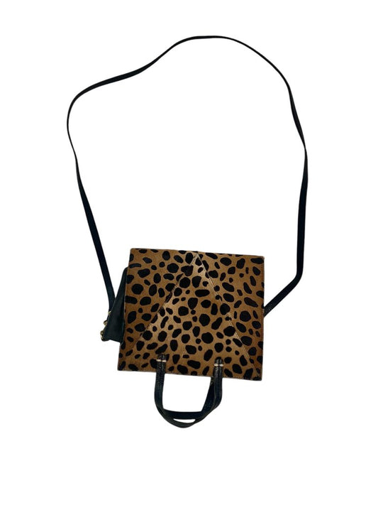 The Clare V Pieced Leopard Crossbody Bag is a striking accessory that combines different textures and prints for a playful yet sophisticated look. Its adjustable strap and compact design make it both functional and stylish, perfect for adding a touch of wild elegance to any outfit.