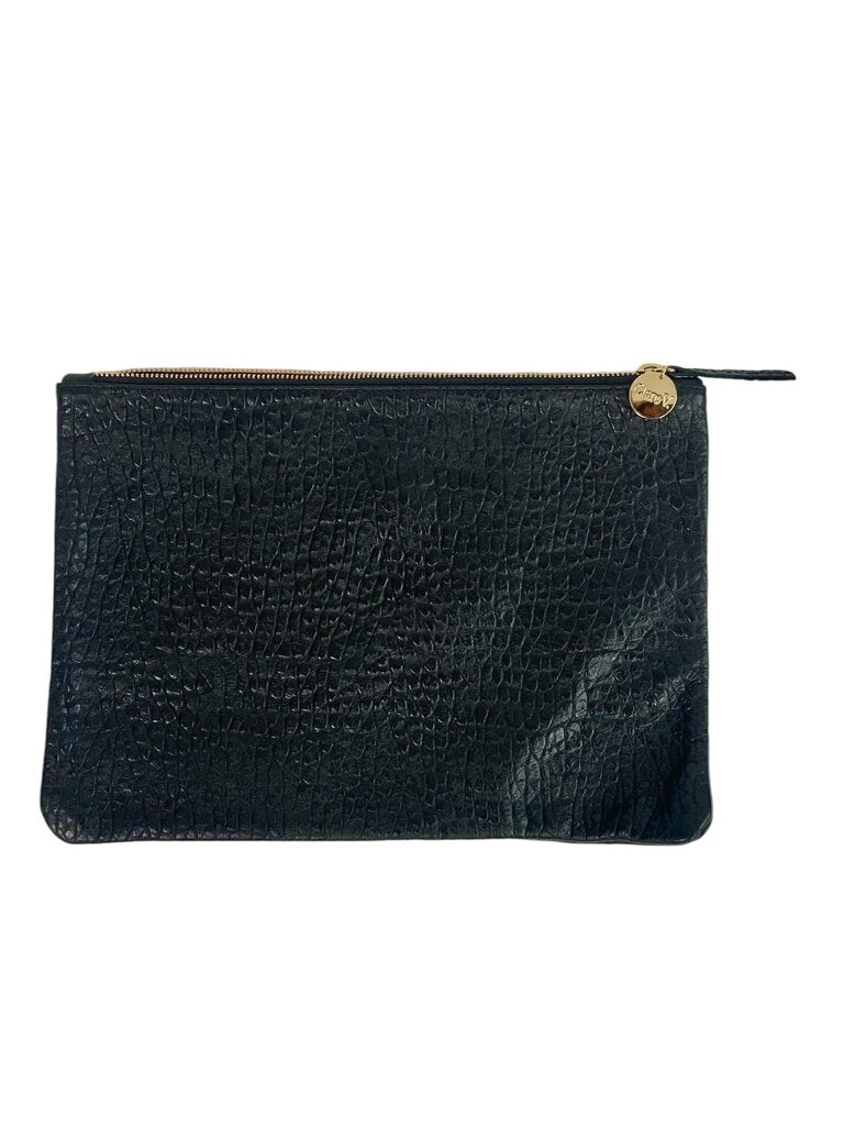 The Clare V Textured Leather Clutch Bag is a chic and versatile accessory, crafted from premium textured leather that adds a sophisticated touch. Its sleek design and spacious interior make it perfect for both day and evening wear, effortlessly elevating any outfit.