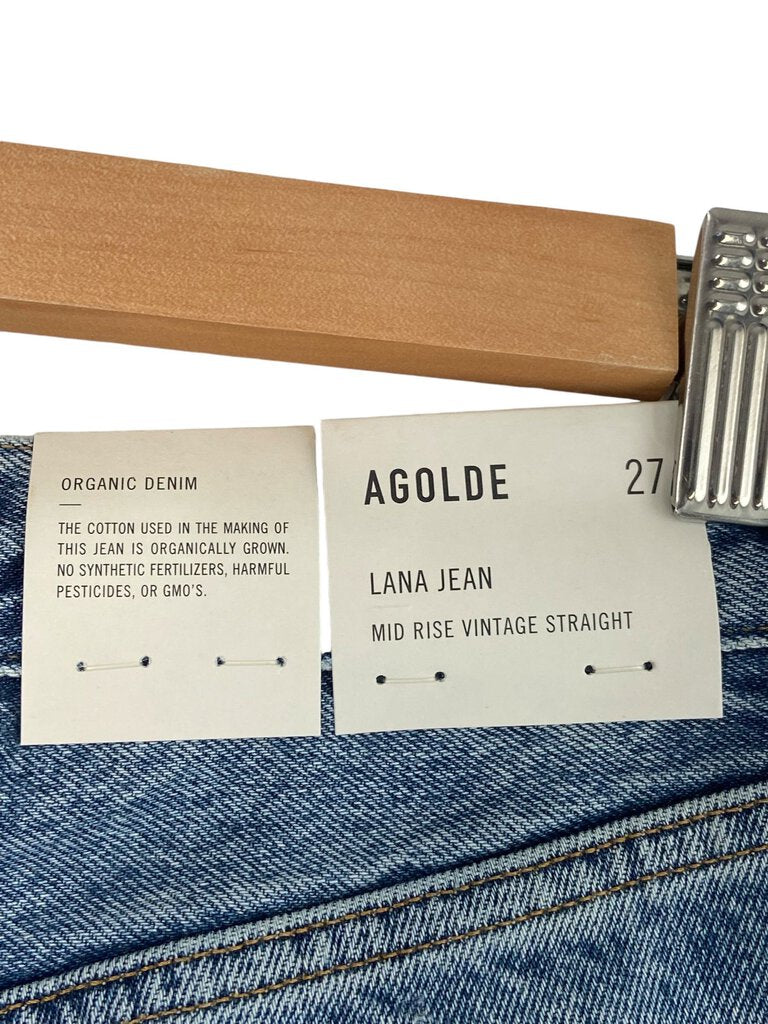 The Agolde 'Lana' Mid Rise Jeans are a stylish and flattering option, featuring a classic mid-rise fit that enhances the silhouette. Crafted from high-quality denim with a modern, slightly relaxed cut, these jeans offer both comfort and versatility, making them ideal for everyday wear.