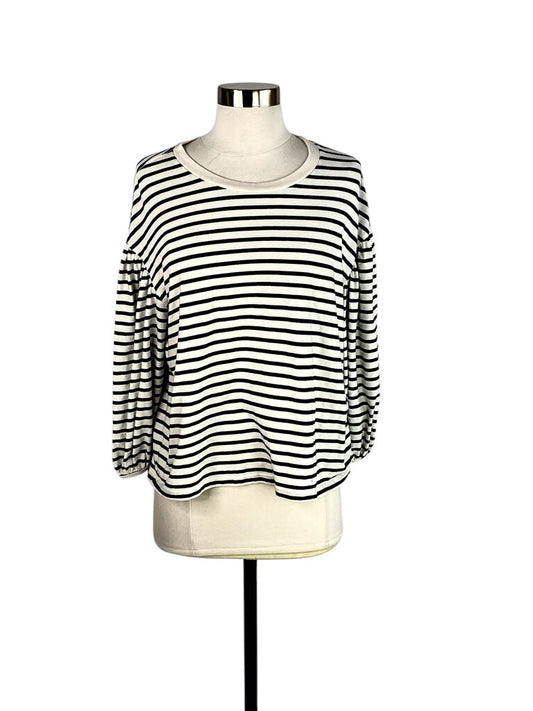 The Clare V Striped Puff Sleeve Top is a playful and stylish piece, featuring bold stripes and charming puff sleeves that add a touch of femininity. Crafted from lightweight fabric, it offers a relaxed fit, making it perfect for casual outings or dressing up for a fun night out.