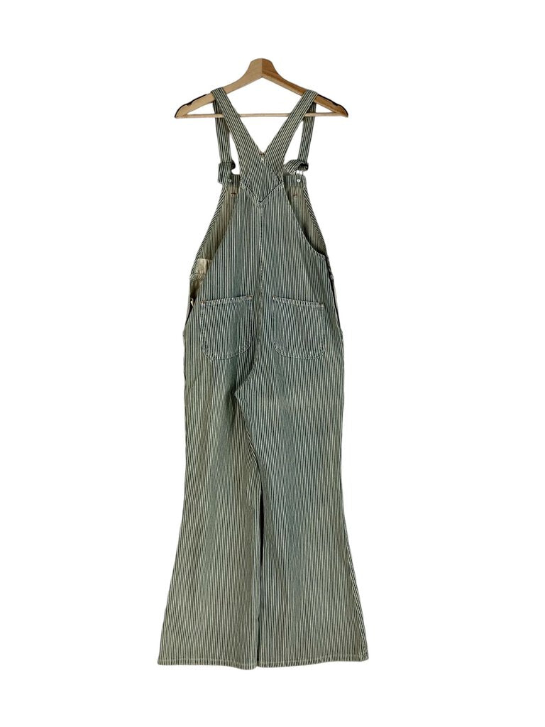 The Christy Dawn Railroad Stripe Overalls are a charming and sustainable piece, crafted from soft, eco-friendly fabric with a classic railroad stripe pattern. Their relaxed fit and adjustable straps provide comfort and style, making them perfect for casual outings or laid-back days.