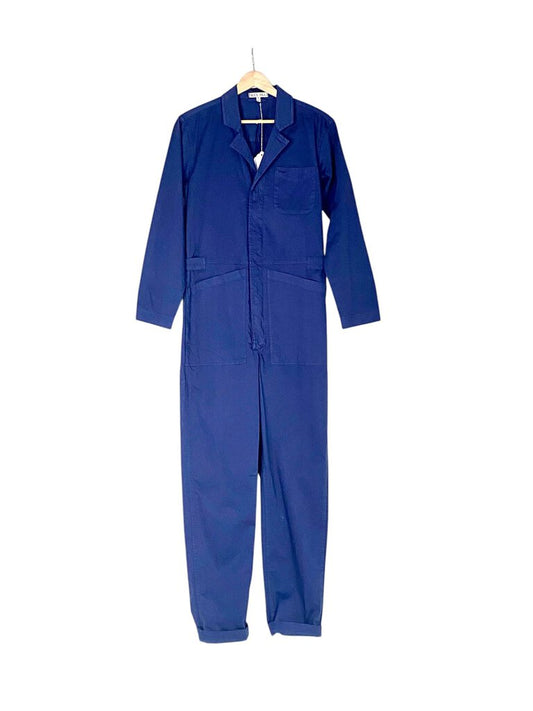 The Alex Mill Coverall Jumpsuit is a modern take on classic workwear, crafted from durable, soft fabric with a relaxed, oversized fit. Featuring a front zipper, utility pockets, and a cinched waist, it combines comfort and utility with effortless, everyday style.