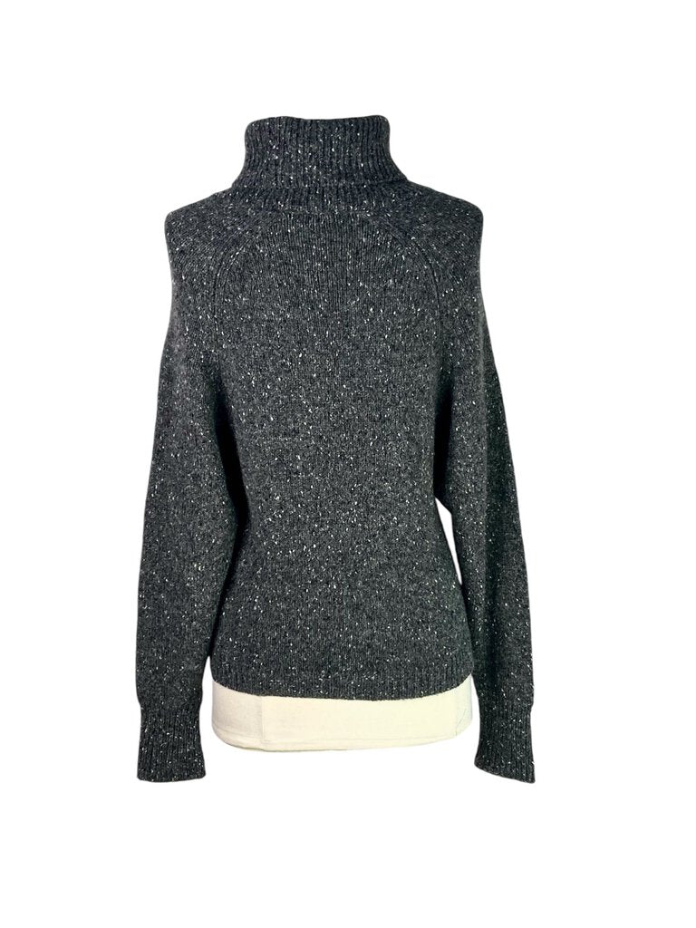 The Vince Salt + Pepper Cashmere Turtleneck Sweater is a luxurious staple, crafted from soft cashmere in a timeless salt-and-pepper knit. Its cozy turtleneck and relaxed fit make it perfect for layering, offering both warmth and sophistication for any season.