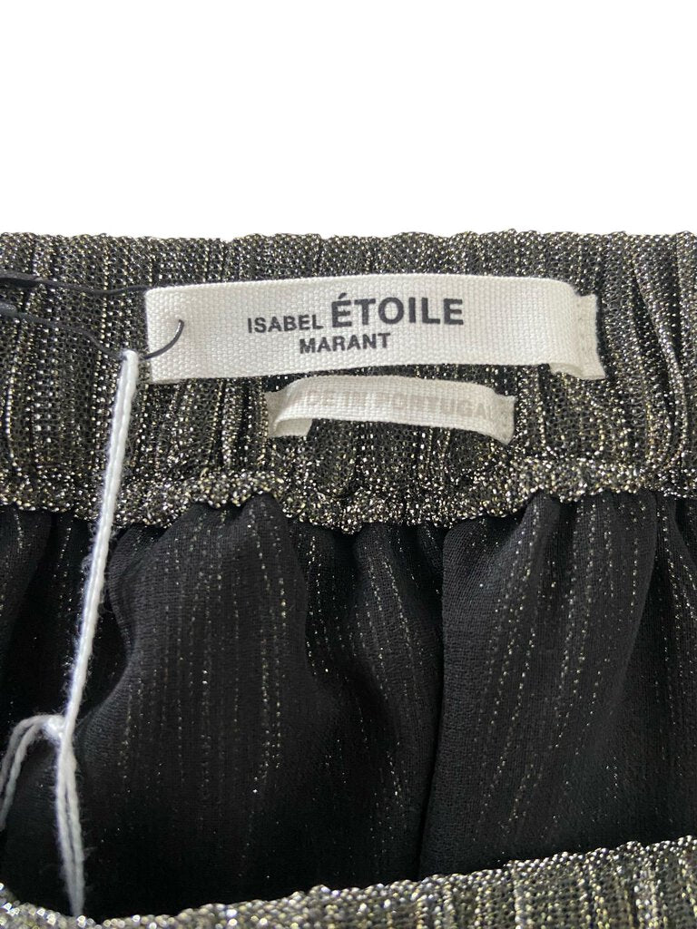 The Isabel Marant Étoile Plisse Maxi Skirt is a flowy and elegant piece, featuring intricate pleating that creates beautiful movement and texture. With its relaxed silhouette and versatile design, this maxi skirt can be styled for both casual and dressy occasions, making it a chic addition to any wardrobe.