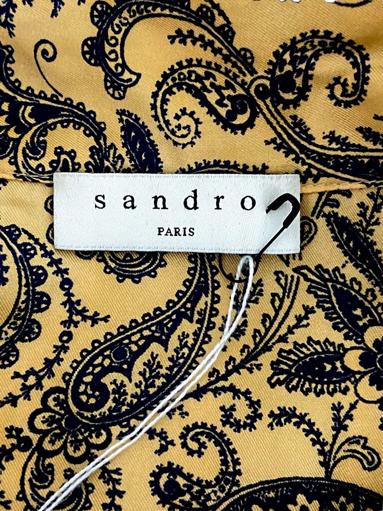 The Sandro Paris Silk Paisley Print Long Sleeve Tunic Dress is a beautifully elegant piece, featuring a vibrant paisley print on luxurious silk for a touch of sophistication. Its long sleeves and relaxed tunic silhouette make it perfect for both casual outings and more polished events, offering effortless style and comfort.