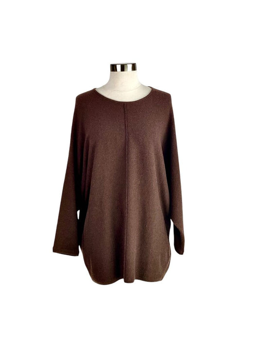 The Co Cashmere Dolman Sweater is a luxurious and effortlessly chic piece, featuring a relaxed dolman silhouette that drapes beautifully. Crafted from soft cashmere, it offers exceptional comfort and warmth, making it a versatile staple for both casual and polished looks.