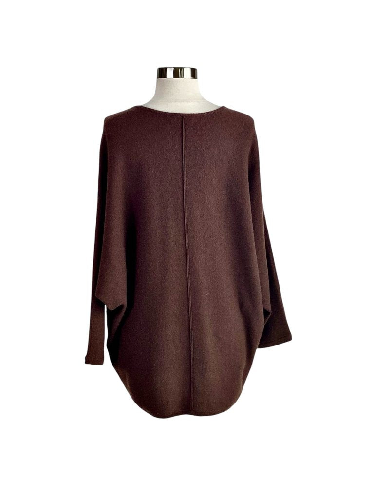 The Co Cashmere Dolman Sweater is a luxurious and effortlessly chic piece, featuring a relaxed dolman silhouette that drapes beautifully. Crafted from soft cashmere, it offers exceptional comfort and warmth, making it a versatile staple for both casual and polished looks.