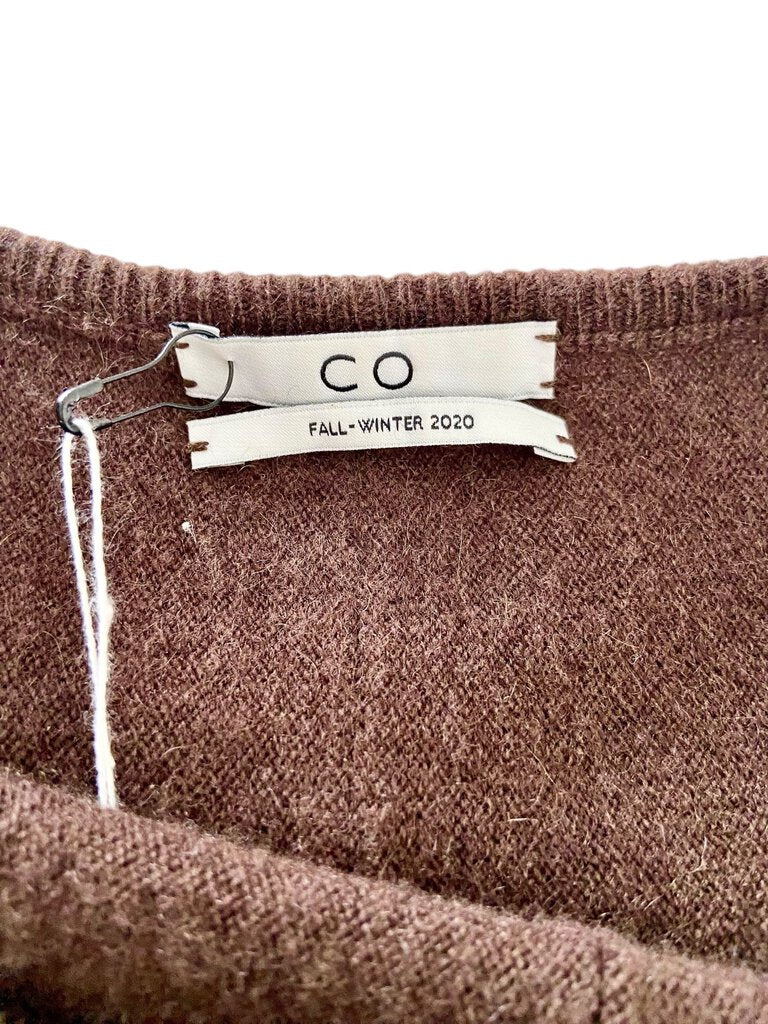 The Co Cashmere Dolman Sweater is a luxurious and effortlessly chic piece, featuring a relaxed dolman silhouette that drapes beautifully. Crafted from soft cashmere, it offers exceptional comfort and warmth, making it a versatile staple for both casual and polished looks.