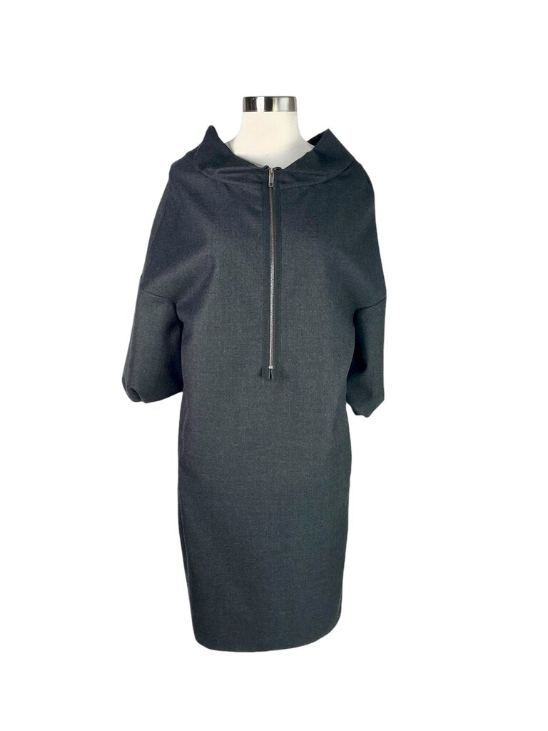 The Marni Zip Exposed Zipper Front Wool Dress is a striking blend of modern design and classic elegance, featuring an exposed zipper that adds an edgy touch to its sophisticated silhouette. Crafted from high-quality wool, this dress offers both comfort and style, making it a standout choice for any occasion.