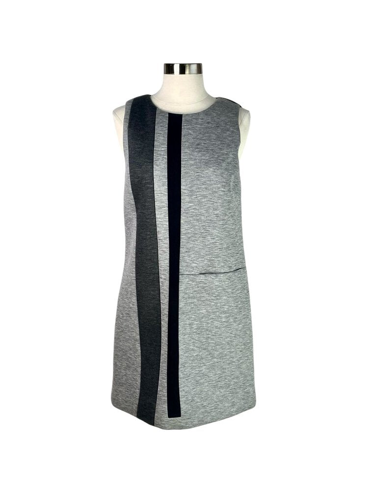 The Lisa Perry Sleeveless Scuba Dress is a bold and contemporary piece, crafted from stretchy scuba fabric that flatters the silhouette while offering a structured look. With its sleeveless design and vibrant colors, this dress is perfect for making a statement at any occasion.