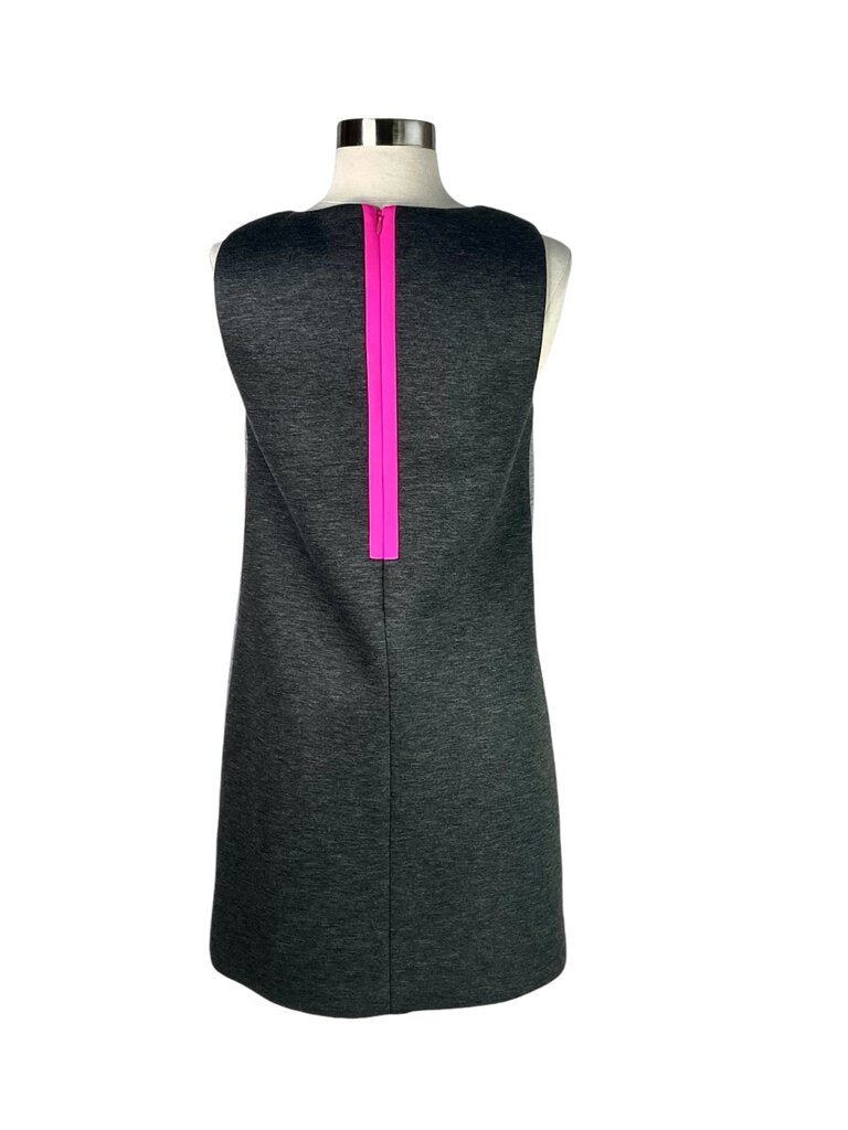 The Lisa Perry Sleeveless Scuba Dress is a bold and contemporary piece, crafted from stretchy scuba fabric that flatters the silhouette while offering a structured look. With its sleeveless design and vibrant colors, this dress is perfect for making a statement at any occasion.