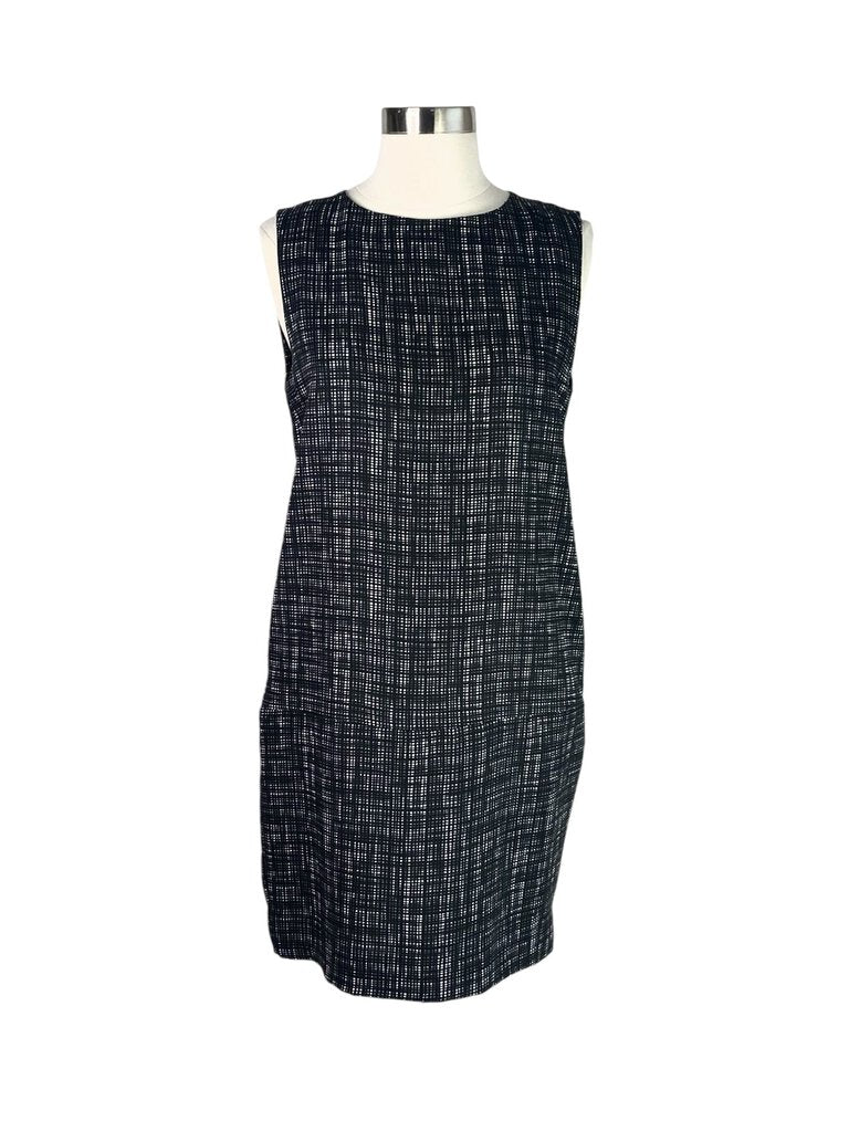 The Marni Sleeveless Printed Sheath Dress is a bold and artistic piece, featuring vibrant prints that embody the brand's signature eclectic style. With its form-fitting silhouette and sleeveless design, this dress is perfect for making a statement at any event, effortlessly blending sophistication with a touch of creativity.