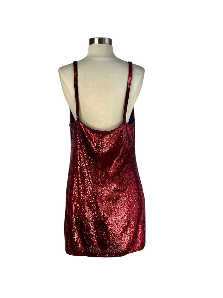 The Reformation Sequin 'Jimmy' Mini Dress is a dazzling, fitted design that features a shimmering sequin fabric, perfect for adding sparkle to any evening event. With its flattering silhouette and bold, eye-catching details, it combines glamour with a playful, modern edge.