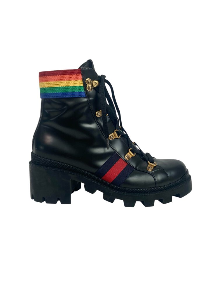 The Gucci 'Rainbow Trip' Combat Boots are a bold and playful footwear choice, featuring a vibrant color palette that adds a fun twist to the classic combat style. Crafted from high-quality materials, these boots combine comfort and edginess, making them perfect for elevating any casual outfit.